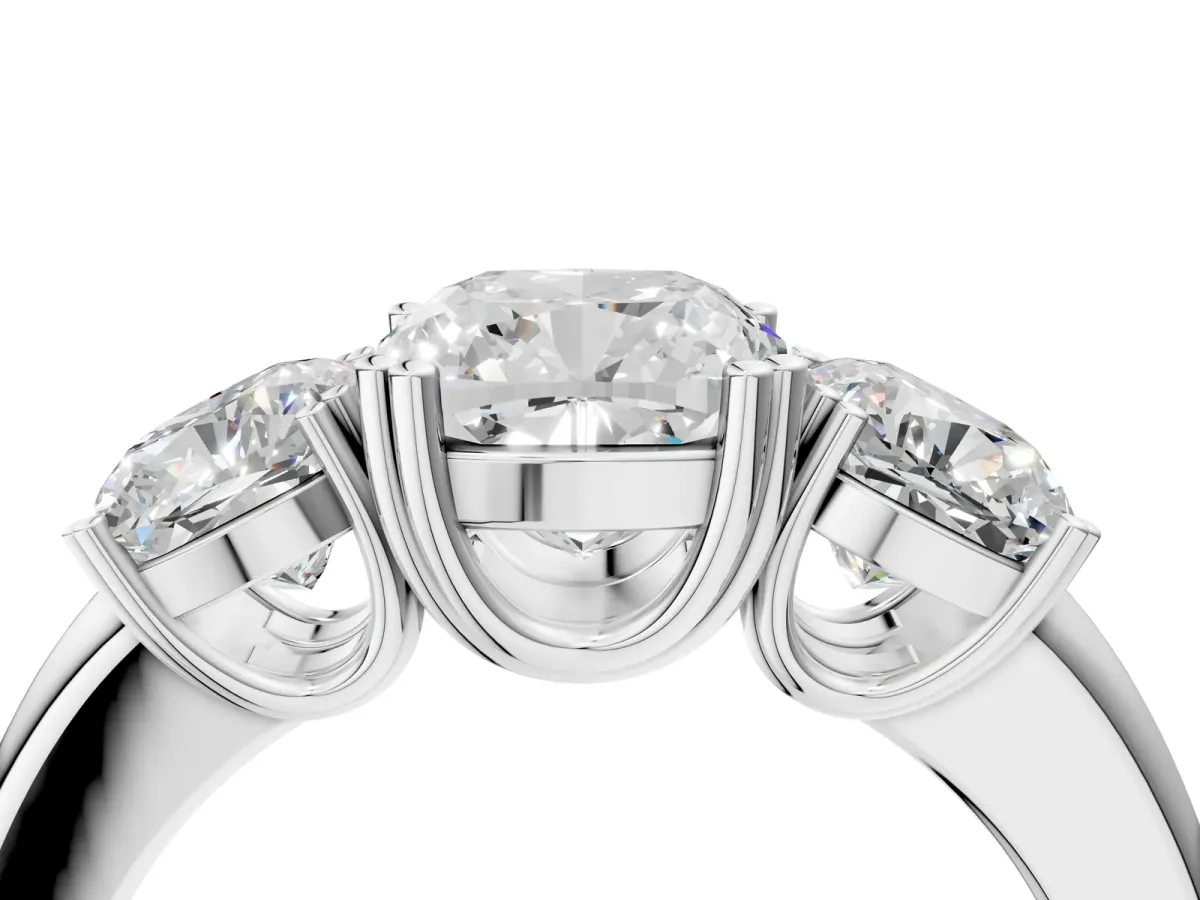 Three-Stone Cushion Cut Cut Diamond Ring with Channel Set Band and Four-Prong Setting White gold