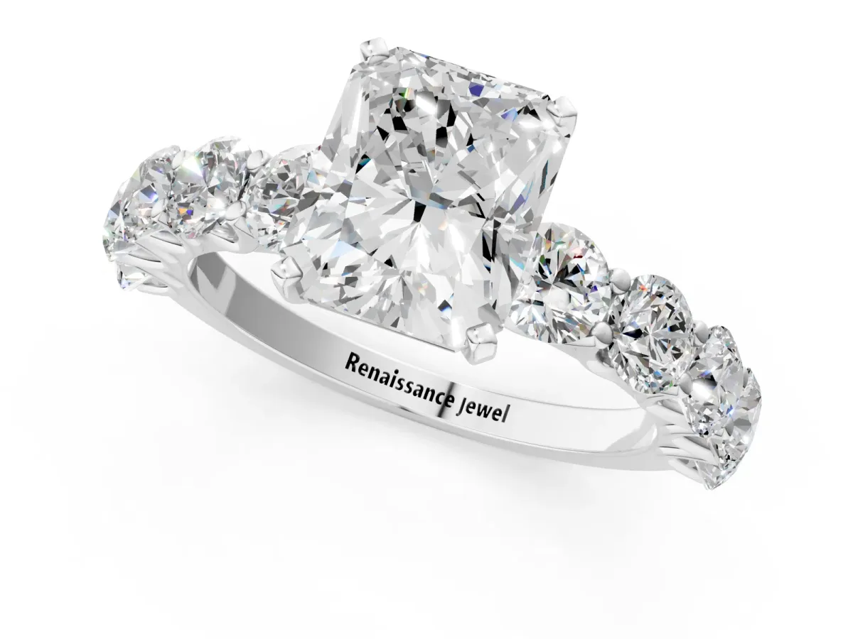 Radiant Cut Diamond Prong Setting with Side Stones on a Pave Band Silver