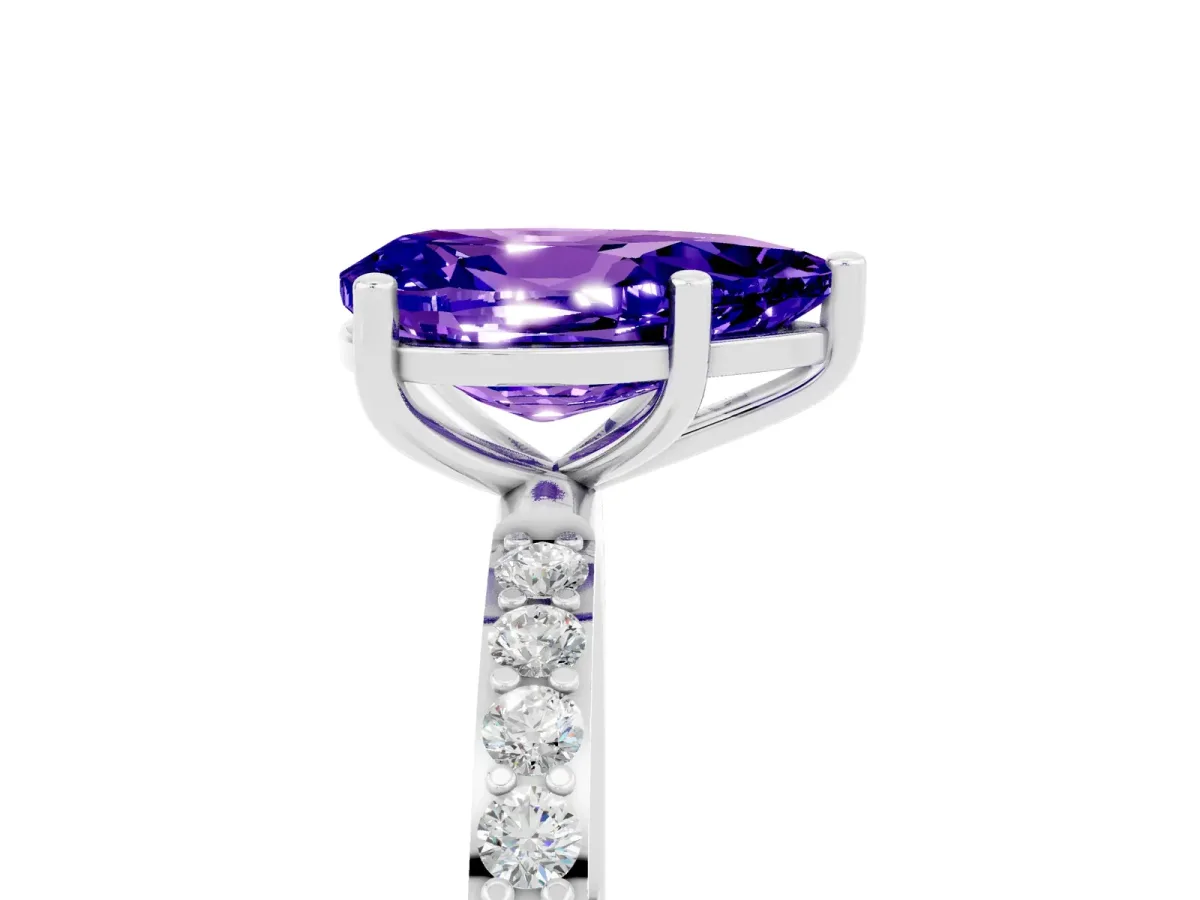 Pear Cut Tanzanite Solitaire Ring with Round Pavé Shoulders and Prong Setting White gold