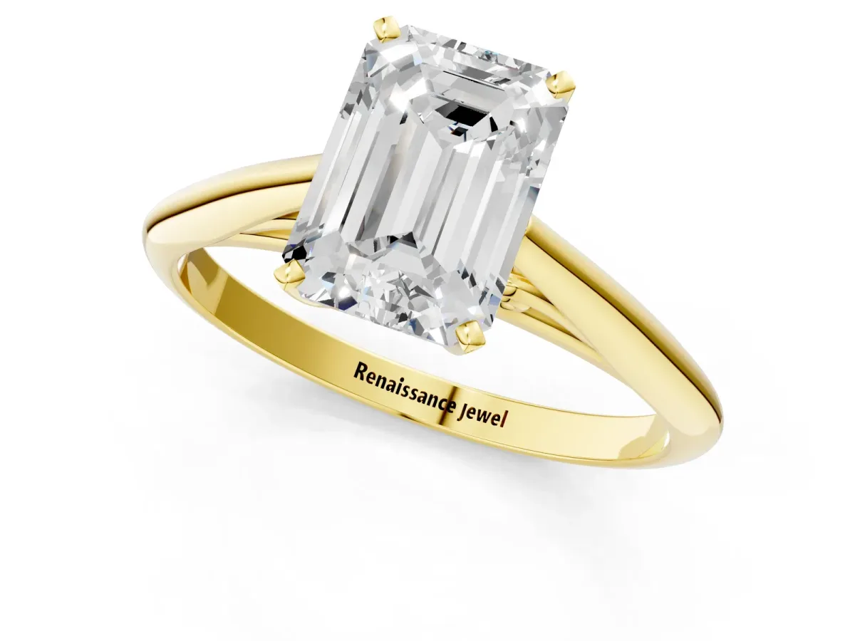 Emerald Cut Diamond Solitaire Engagement Ring with Cathedral Setting and Four-Prong Mount Yellow gold