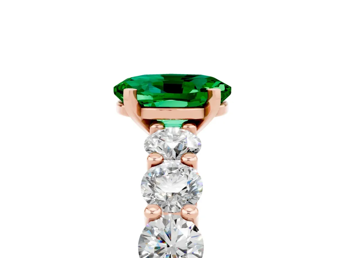 Oval Cut Emerald Prong Setting with Side Stones on a Pave Band Rose gold
