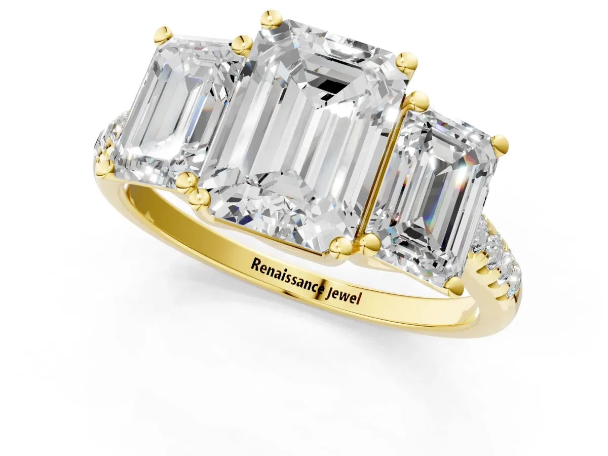 Fancy Blue Three-Stone Emerald Cut Diamond Ring with Round Pavé Band and Prong Setting Yellow gold