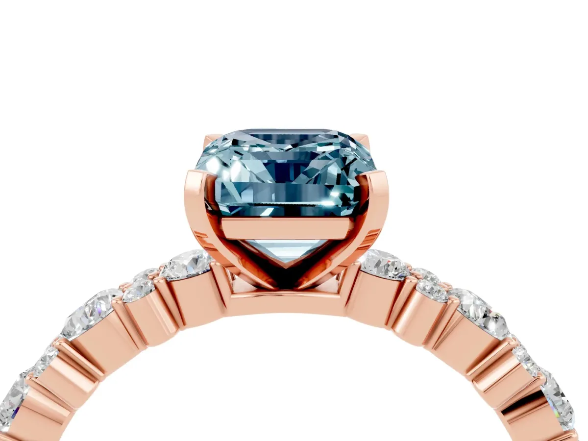 Emerald Cut Aquamarine Side Stone Solitaire Ring with Round and Four-Prong Setting Rose gold