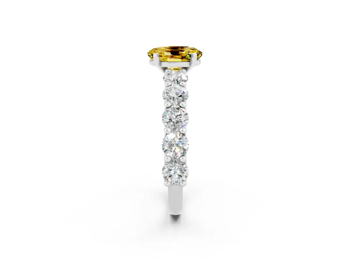 Oval Cut Yellow Sapphire Prong Setting with Side Stones on a Pave Band Platinum