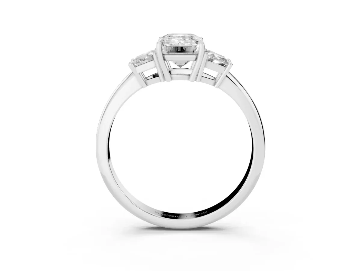 Emerald Cut Diamond Three-Stone Ring with Trapezoid Side Stones and Prong Setting White gold