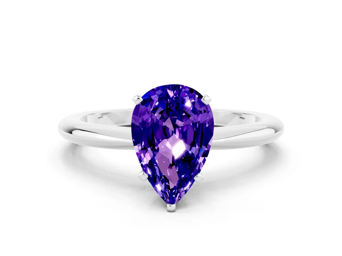 Pear Cut Tanzanite Solitaire Ring with Six-Prong Setting and Classic Band Silver