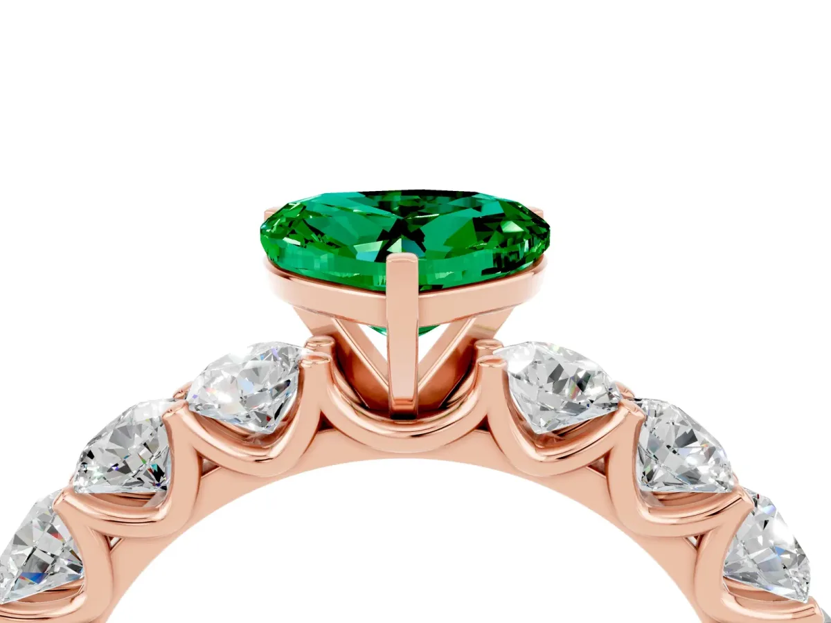 Heart Cut Emerald Prong Setting with Side Stones on a Pave Band Rose gold