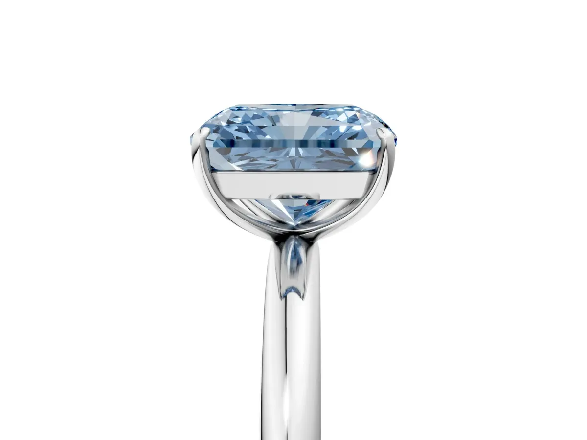 Fancy Blue Radiant Cut Solitaire Diamond Ring with Four-Prong Setting on a Plain Band Platinum