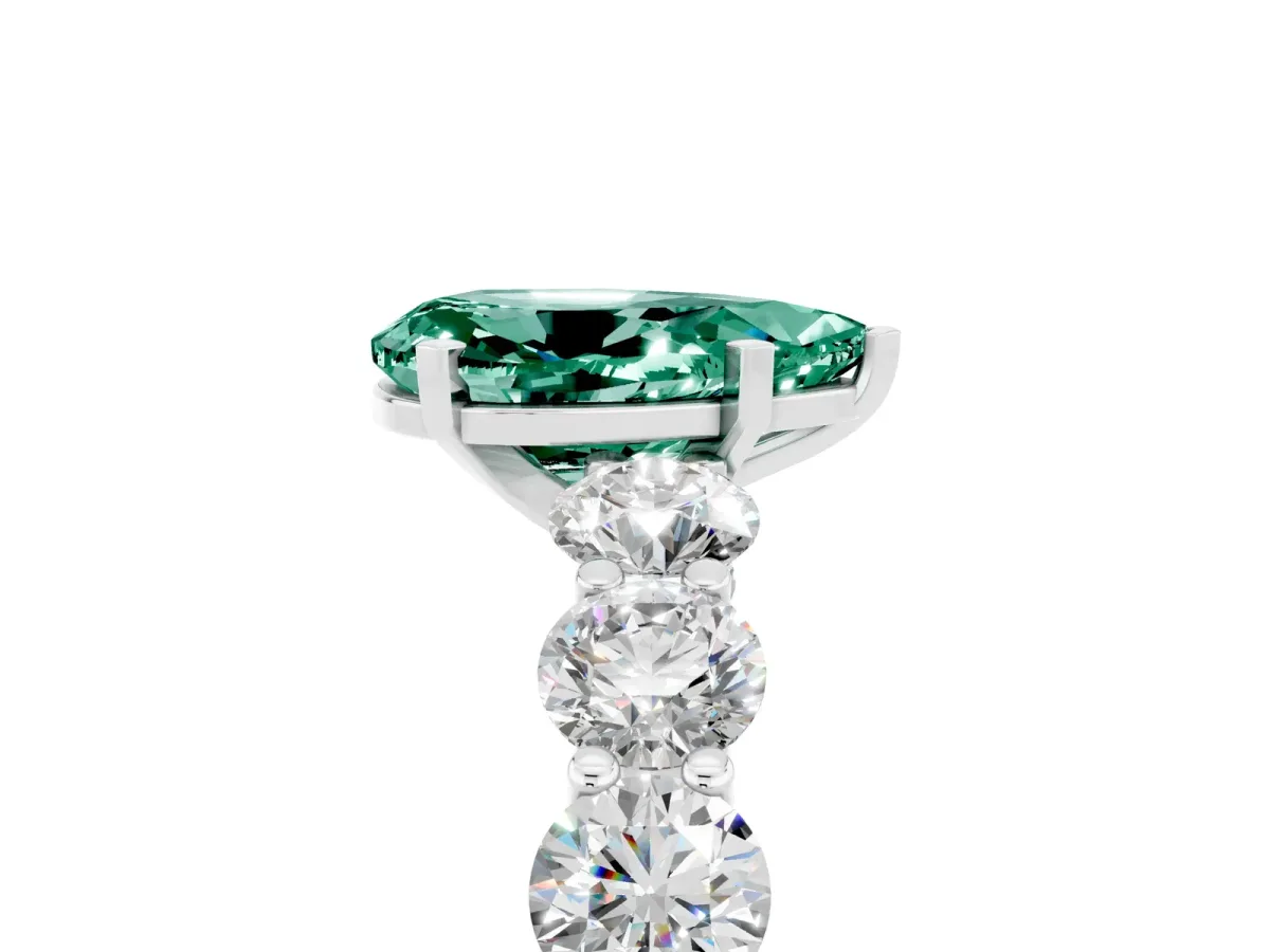 Pear Cut Green Sapphire Prong Setting with Side Stones on a Pave Band Silver
