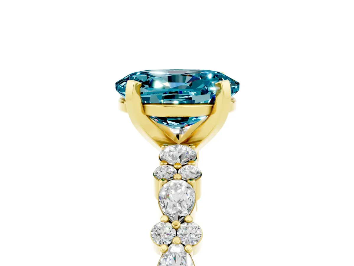 Oval Cut Blue Topaz Side Stone Solitaire Ring with Round and Four-Prong Setting Yellow gold