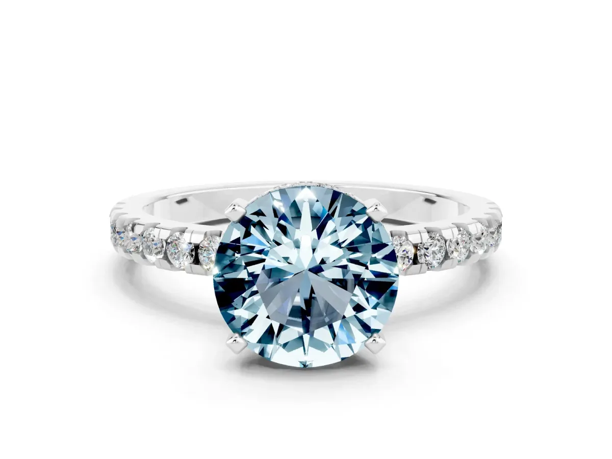 Round Cut Aquamarine Solitaire Ring with Round Pavé Band and Four-Prong Setting Silver