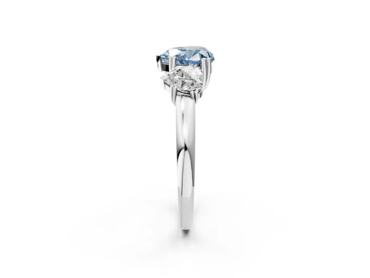 Fancy Blue Three-Stone Heart Cut Cut Diamond Ring with Channel Set Band and Four-Prong Setting Silver