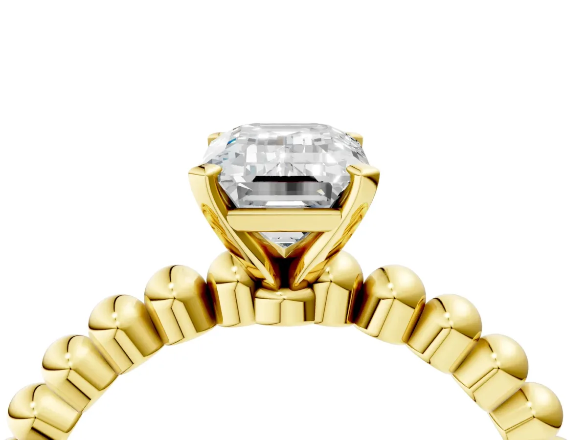 Emerald Cut Diamond Solitaire Ring with Beaded Band and Prong Setting Yellow gold