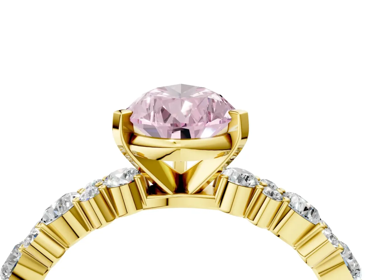 Fancy Pink Pear Cut Diamond Side Stone Solitaire Ring with Round and Four-Prong Setting Yellow gold