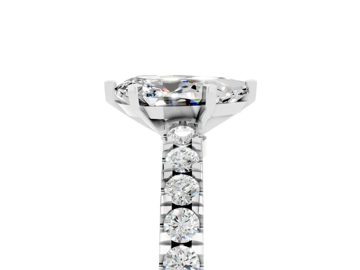 Pear Cut Solitaire Moissanite with Pavé Band and Four-Prong Setting Silver