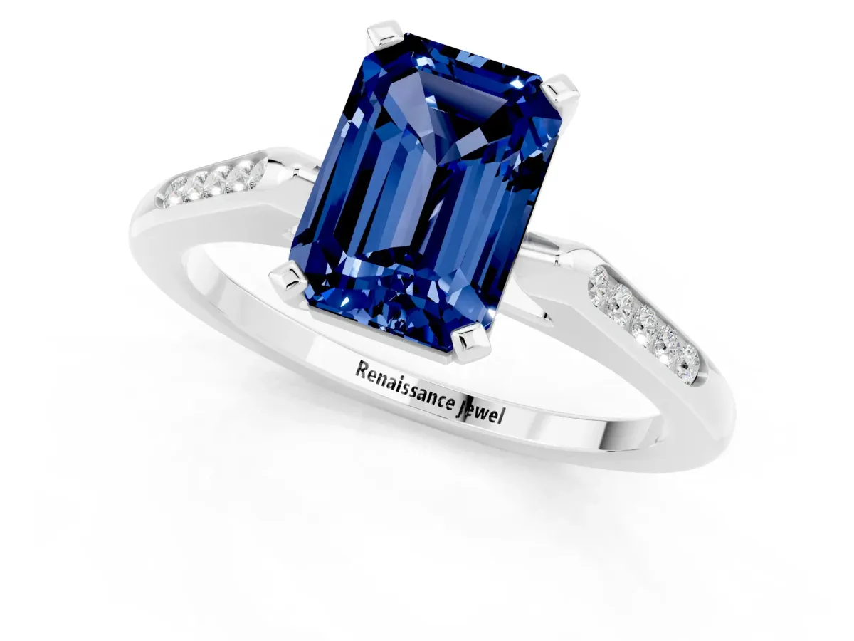 Emerald Cut Blue Sapphire Solitaire Ring with Channel Set Round Band and Prong Setting Silver
