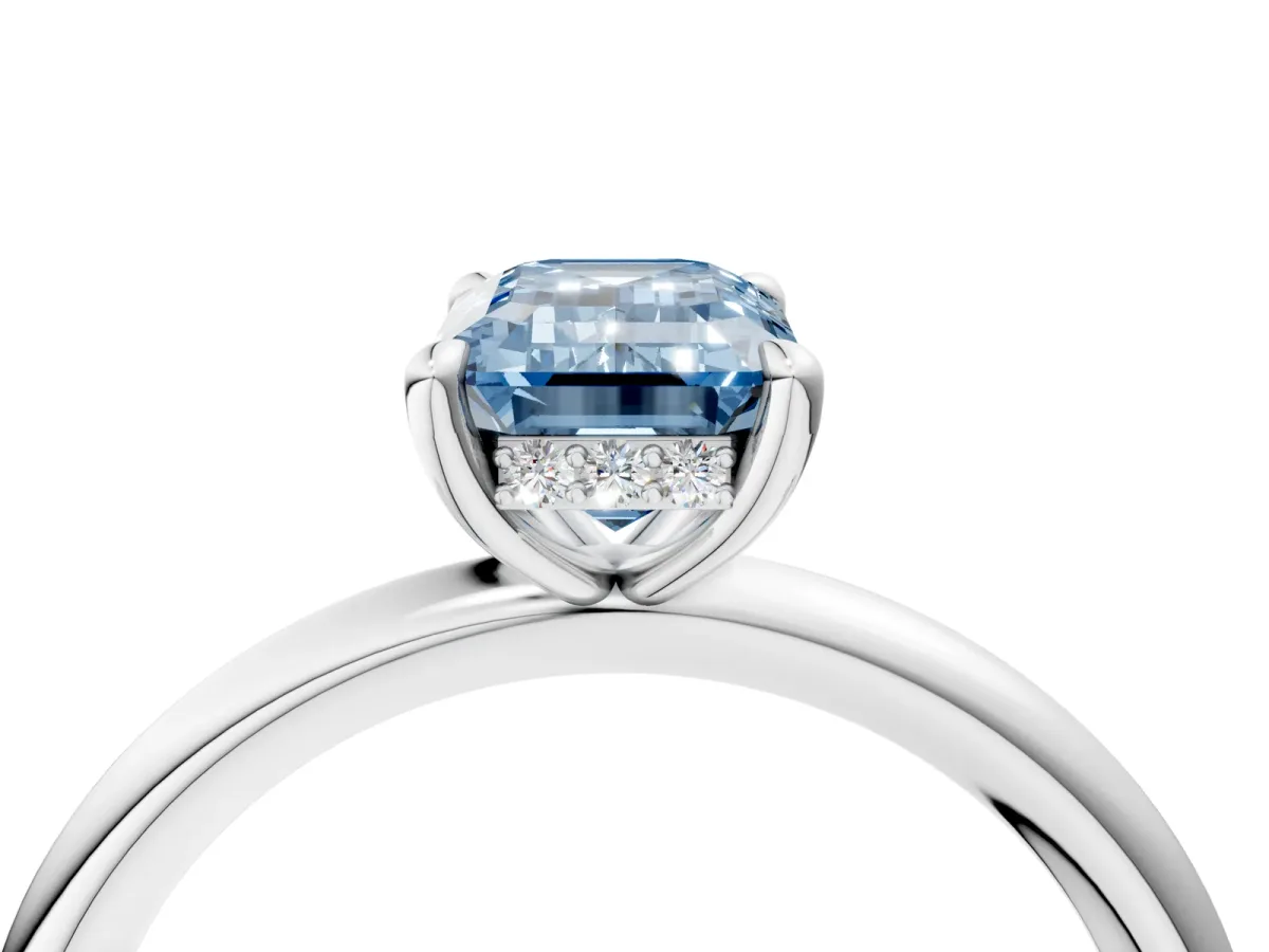 Fancy Blue Emerald Cut Diamond Solitaire Ring with Thin Band and Four-Prong Setting Platinum