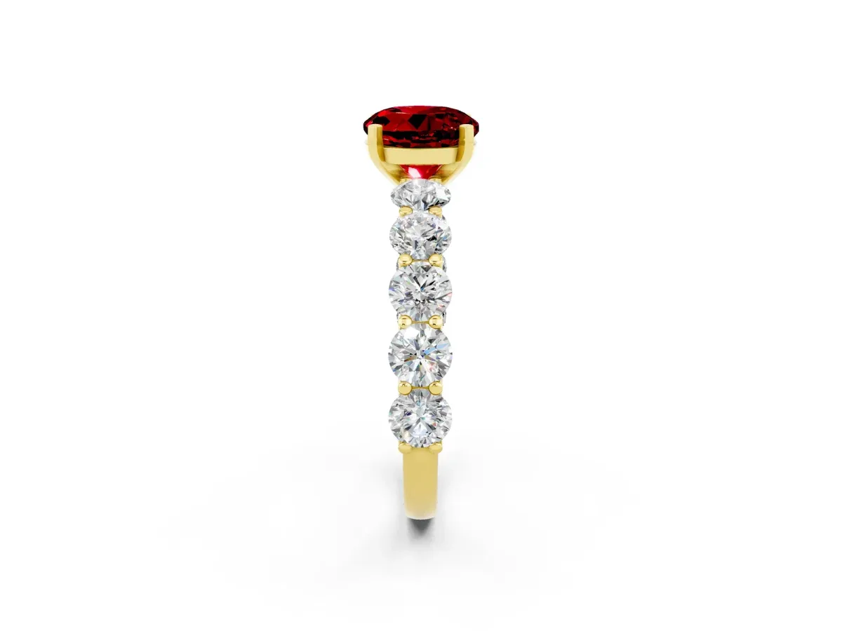 Round Cut Ruby Prong Setting with Side Stones on a Pave Band Yellow gold