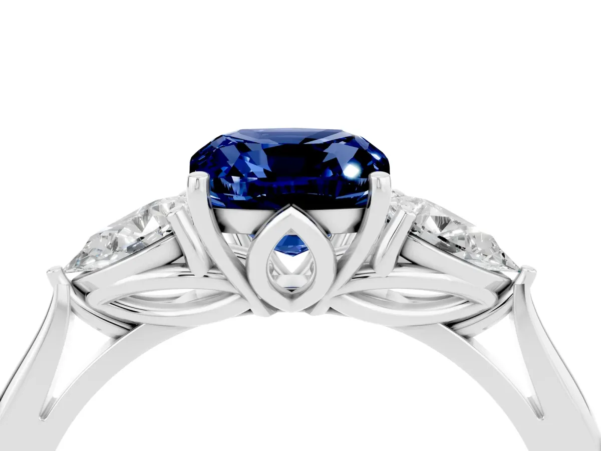 Three-Stone Cushion Cut Blue Sapphire Ring with Pear Side Stones in Four-Prong Setting White gold