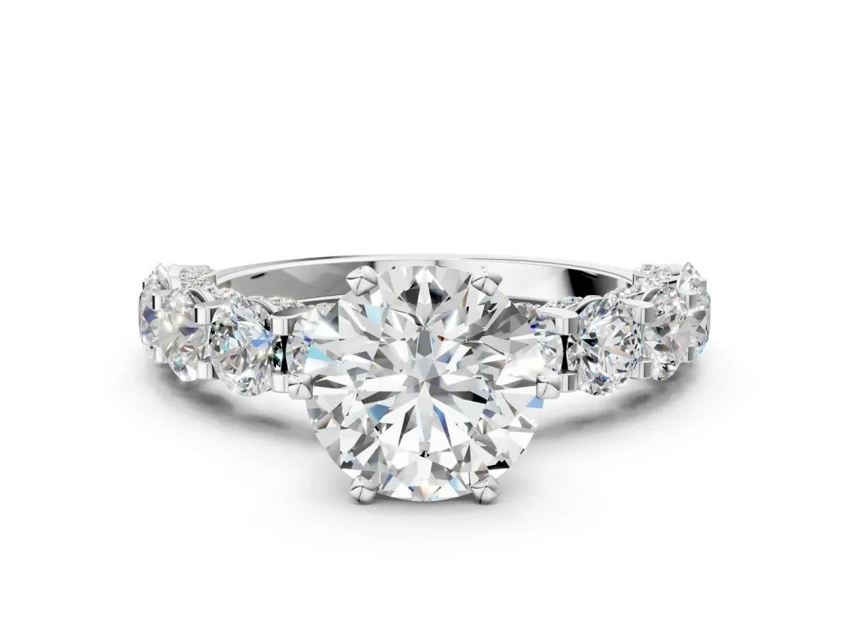 Round Cut Diamond Side Stone Engagement Ring with Four-Prong Setting White gold