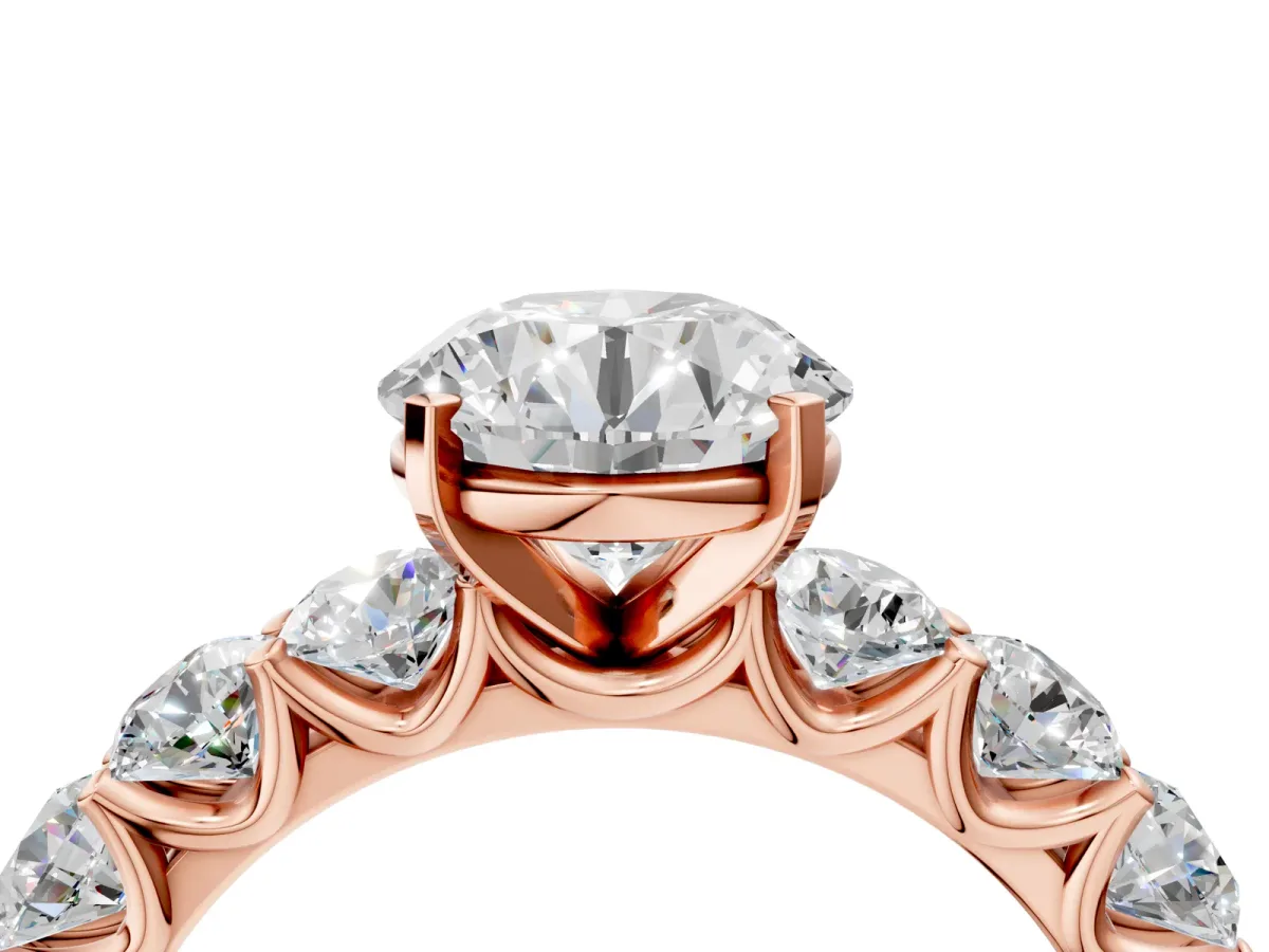 Round Cut Diamond Prong Setting with Side Stones on a Pave Band Rose gold