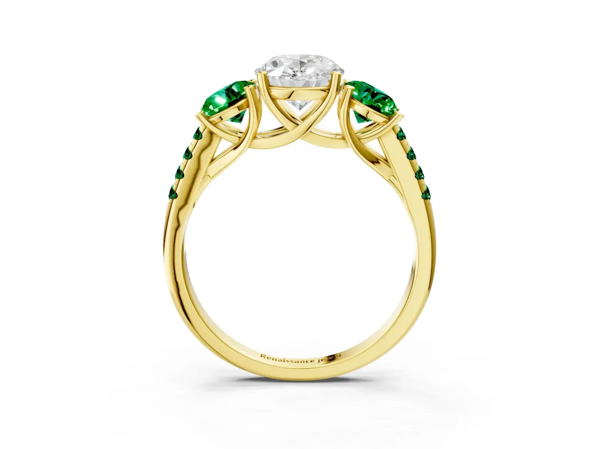 Three-Stone Oval Cut Diamond Ring with Round Emerald Pavé Band and Prong Setting Yellow gold
