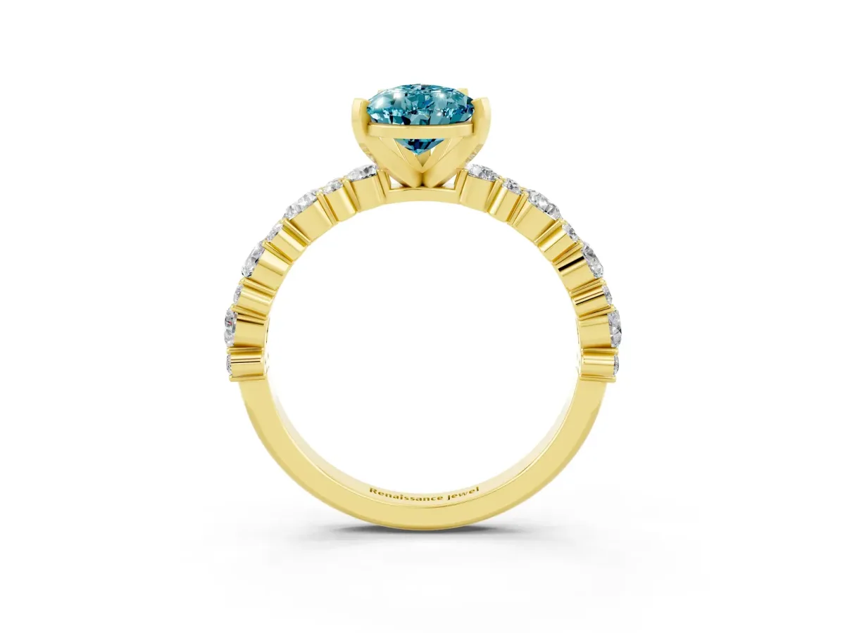 Pear Cut Blue Topaz Side Stone Solitaire Ring with Round and Four-Prong Setting Yellow gold