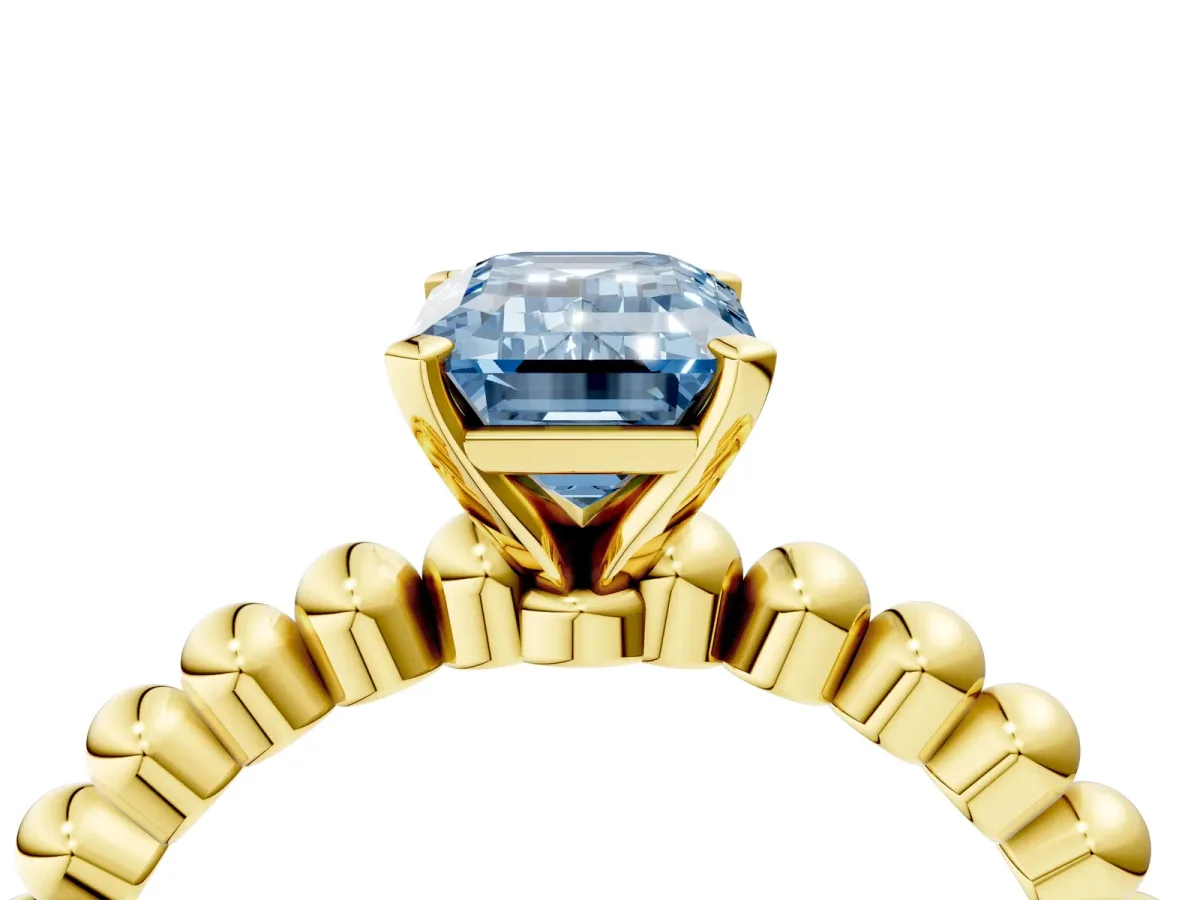 Fancy Blue Emerald Cut Diamond Solitaire Ring with Beaded Band and Prong Setting Yellow gold