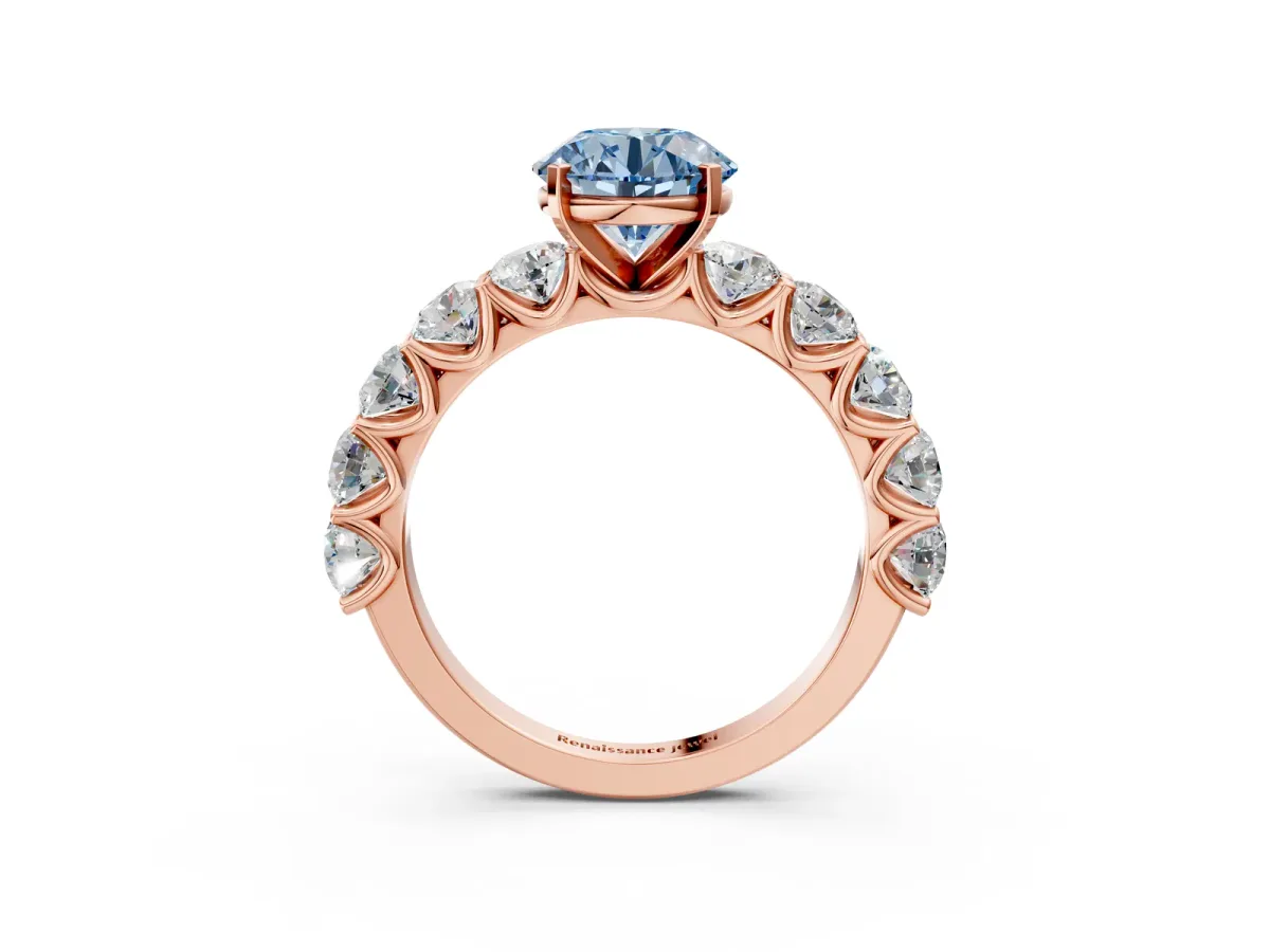 Fancy Blue Round Cut Diamond Prong Setting with Side Stones on a Pave Band Rose gold