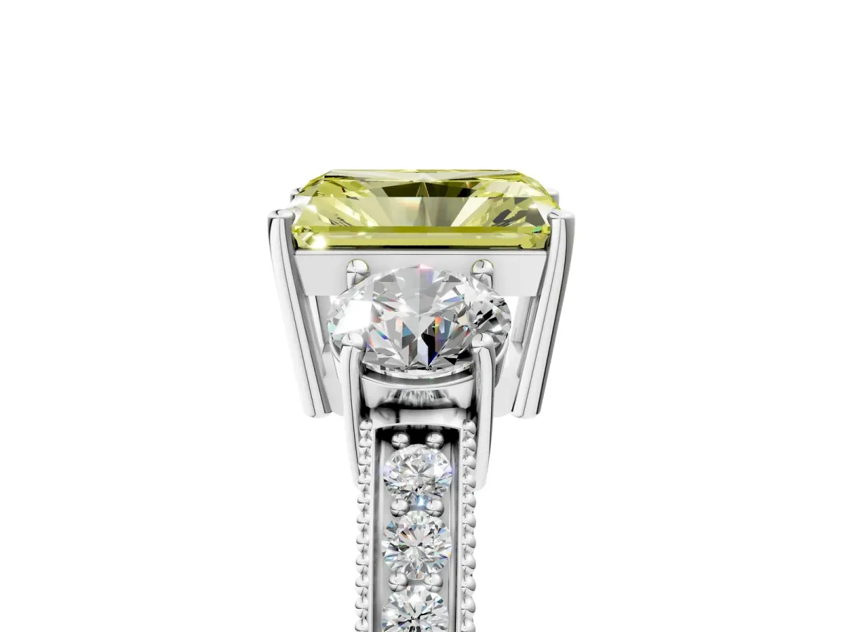 Fancy Yellow Radiant Cut Three-Stone Diamond Ring with Pavé Band and Four-Prong Setting Platinum