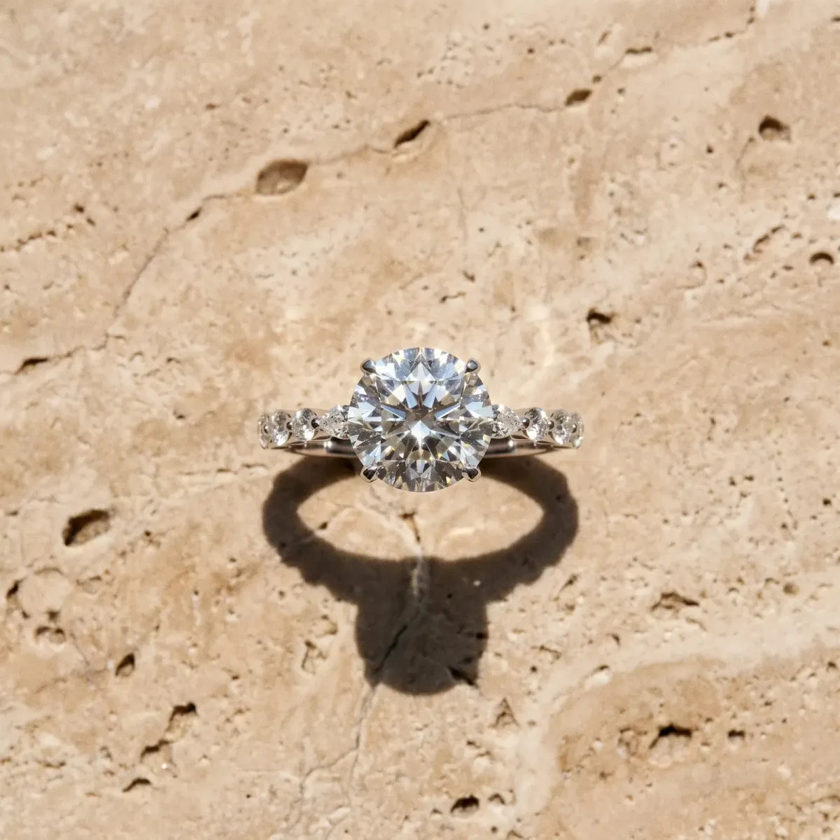 Round Cut Diamond Ring with Marquise and Round Side Stones and Four-Prong Setting Silver