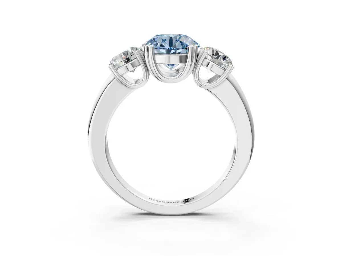 Fancy Blue Three-Stone Round Cut Cut Diamond Ring with Channel Set Band and Four-Prong Setting Platinum