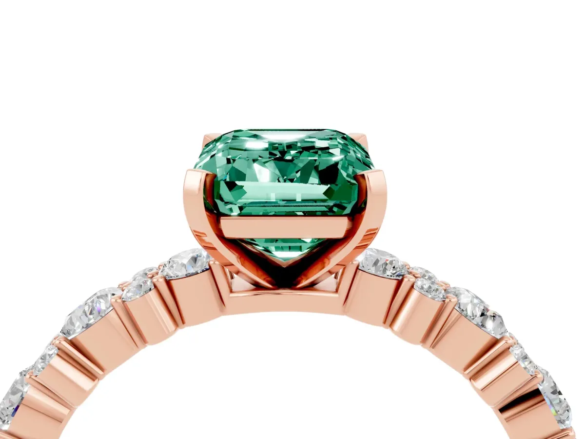 Emerald Cut Green Sapphire Side Stone Solitaire Ring with Round and Four-Prong Setting Rose gold