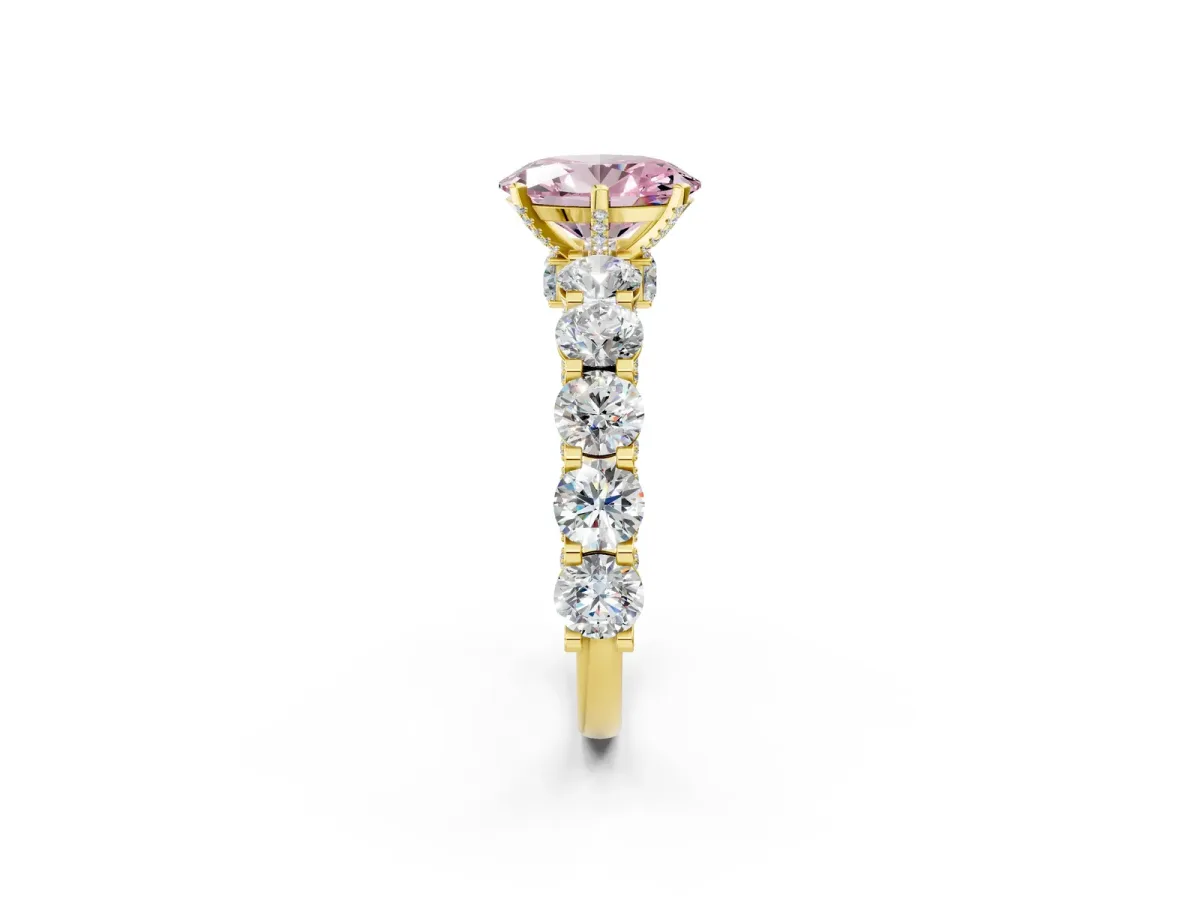 Fancy Pink Oval Cut Diamond Side Stone Engagement Ring with Four-Prong Setting Yellow gold