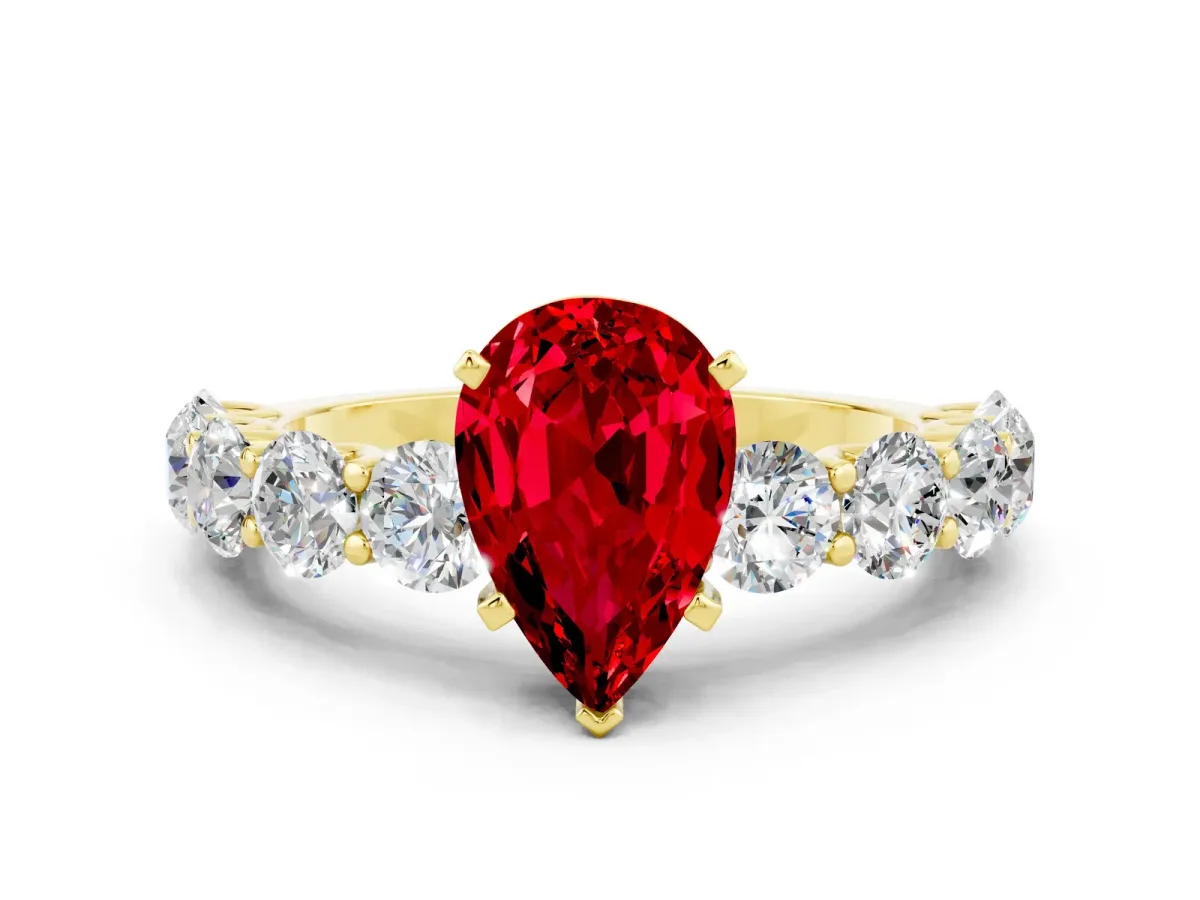 Pear Cut Ruby Prong Setting with Side Stones on a Pave Band Yellow gold