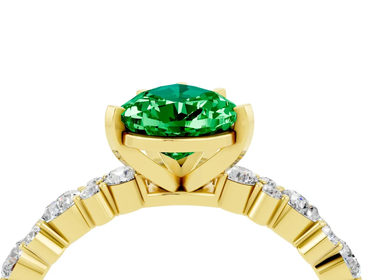 Pear Cut Emerald Side Stone Solitaire Ring with Round and Four-Prong Setting Yellow gold