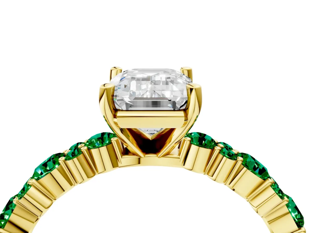 Emerald Cut Diamond Side Stone Solitaire Ring with Round Emerald and Four-Prong Setting Yellow gold