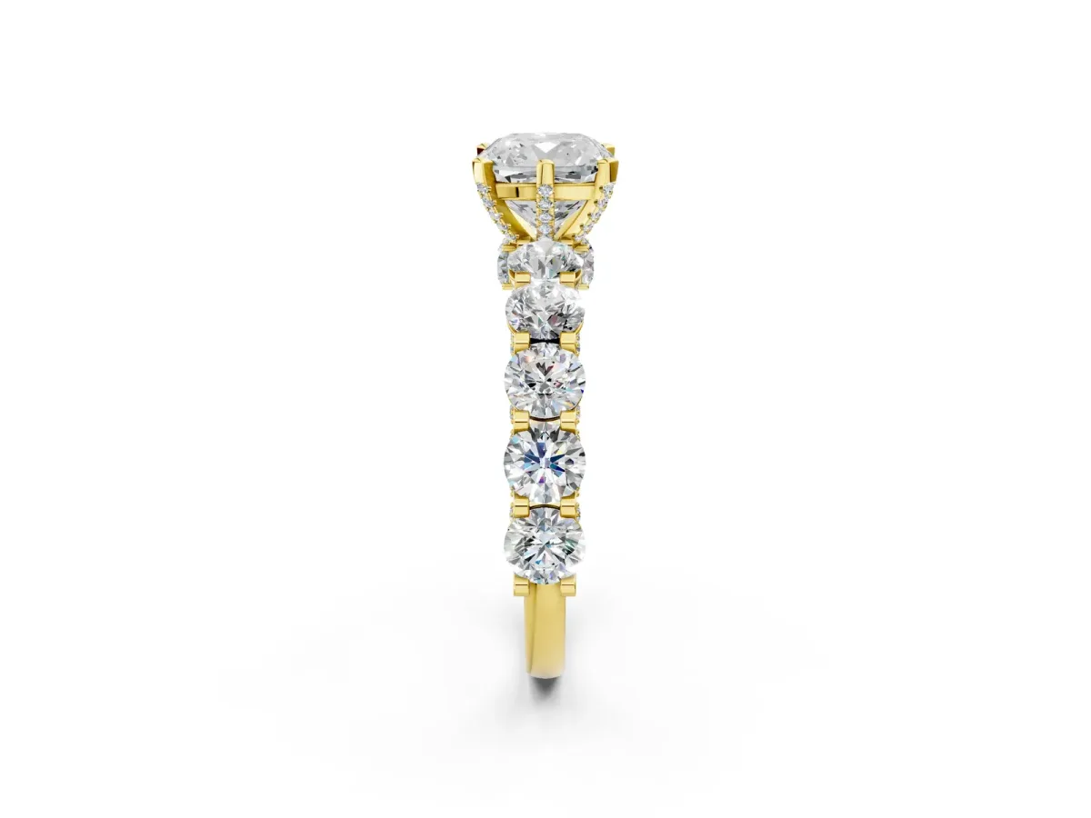 Cushion Cut Diamond Side Stone Engagement Ring with Four-Prong Setting Yellow gold