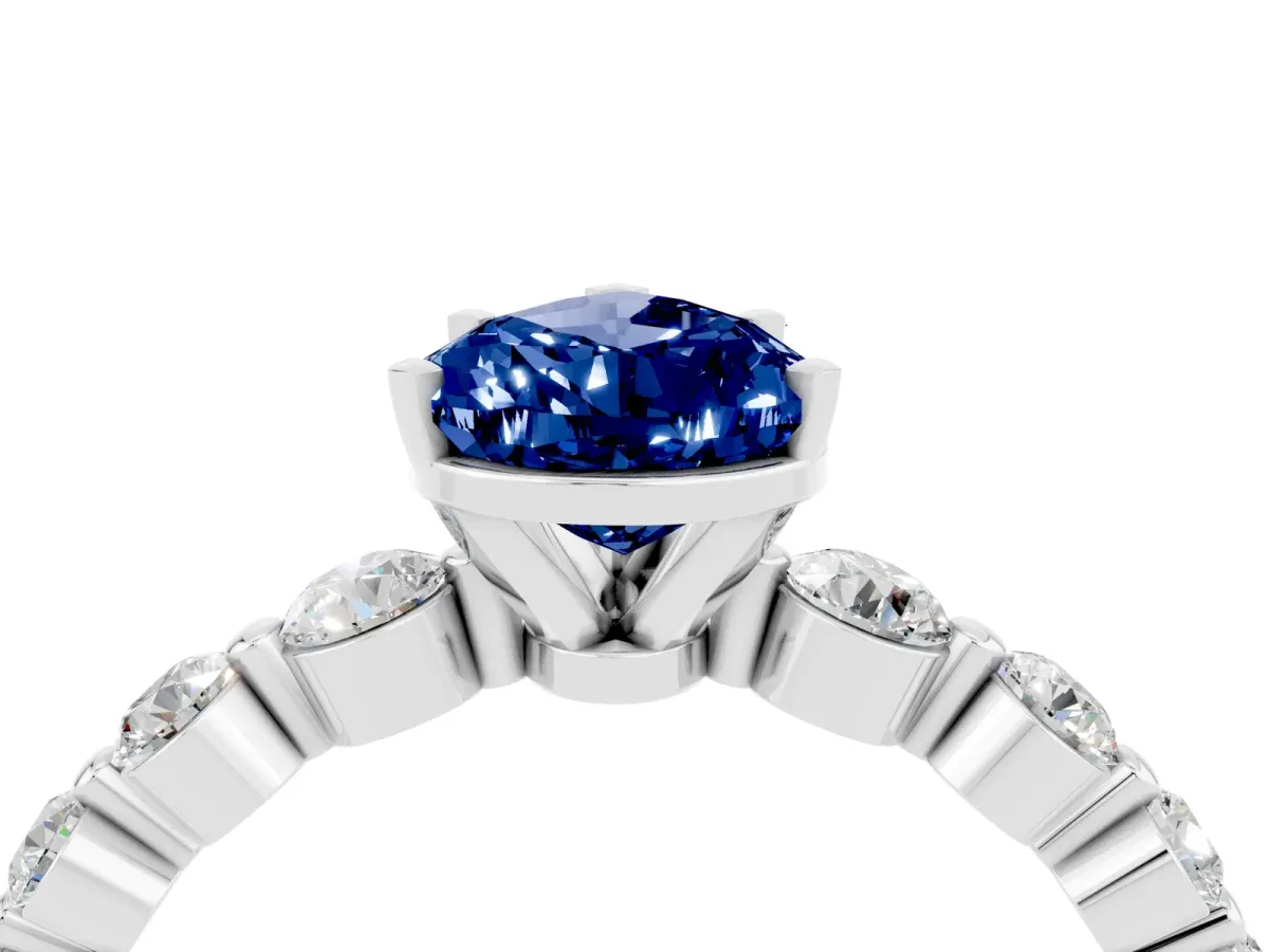 Pear Cut Solitaire Blue Sapphire Ring with Pave Band and Four-Prong Setting Platinum