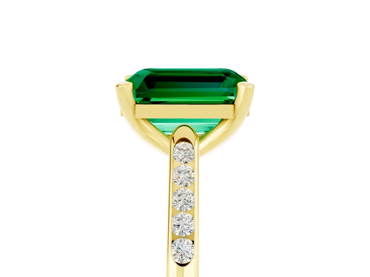 Emerald Cut Emerald Solitaire Ring with Channel Set Round Band and Prong Setting Yellow gold