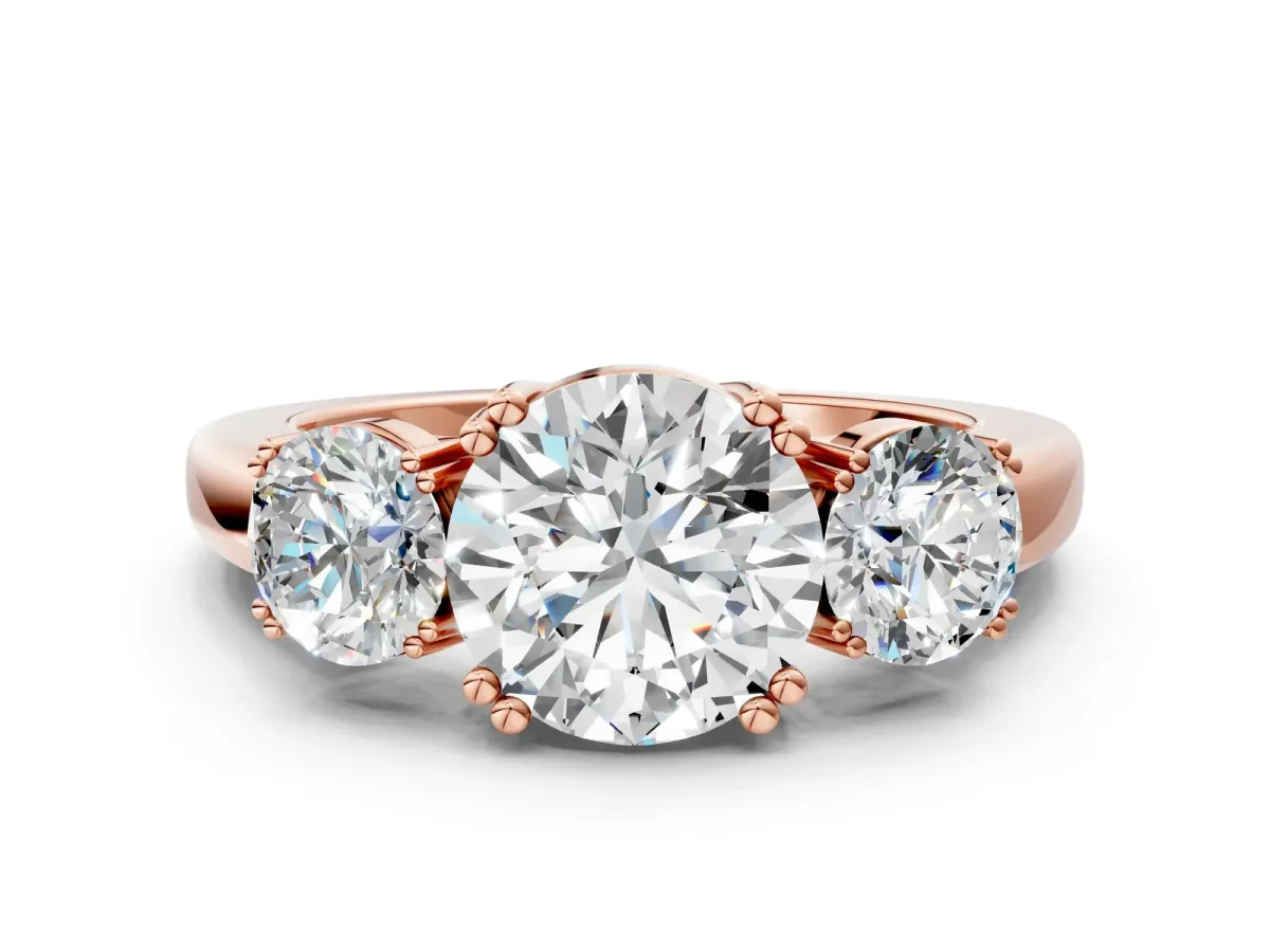 Three-Stone Round Cut Cut Diamond Ring with Channel Set Band and Four-Prong Setting Rose gold