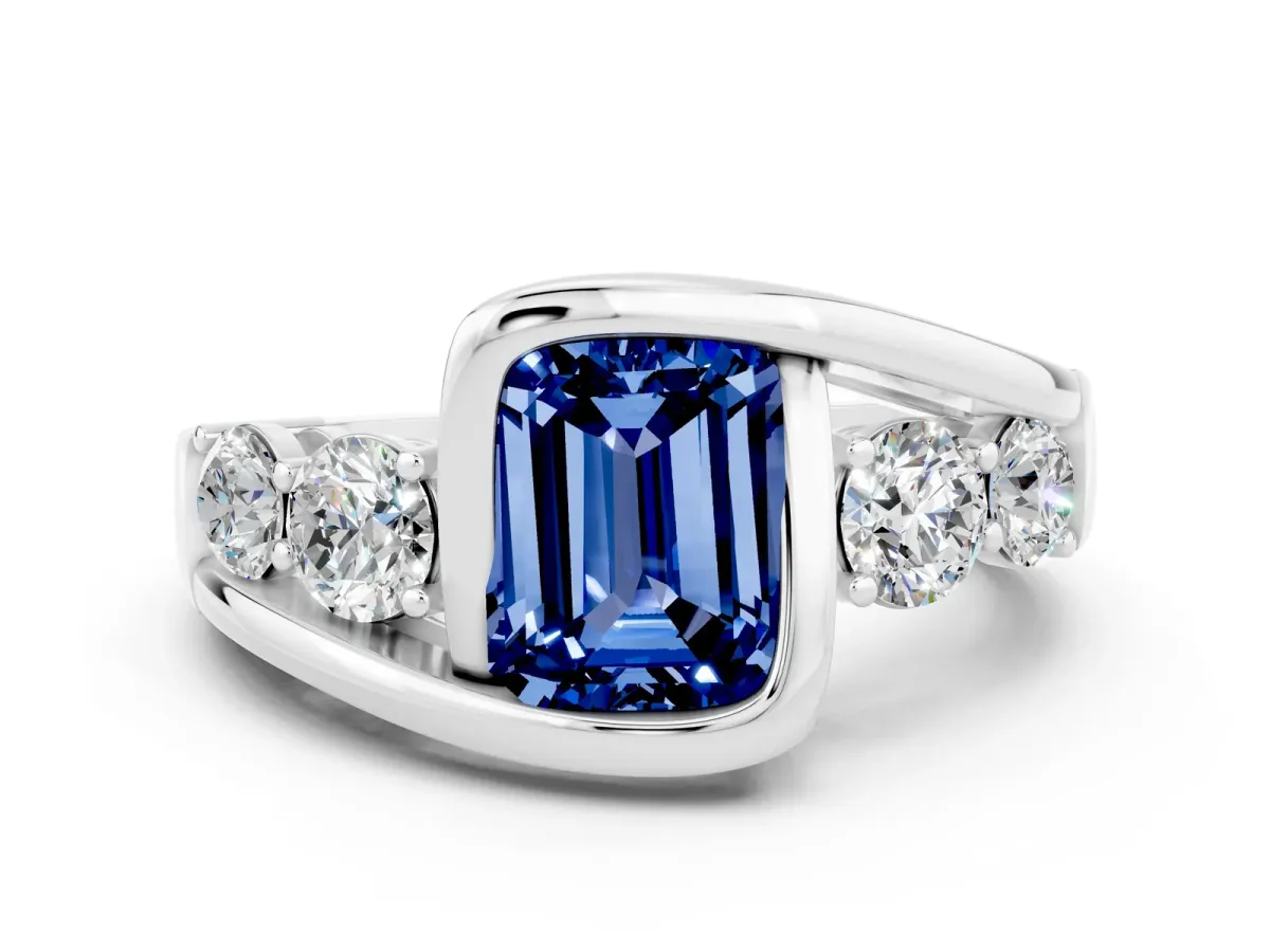 Bezel Set Emerald Cut Blue Sapphire Bypass Ring with Round Accents Platinum