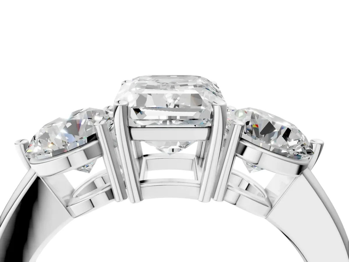 Emerald Cut Diamond Three-Stone Ring with Prong Setting and Classic Band White gold