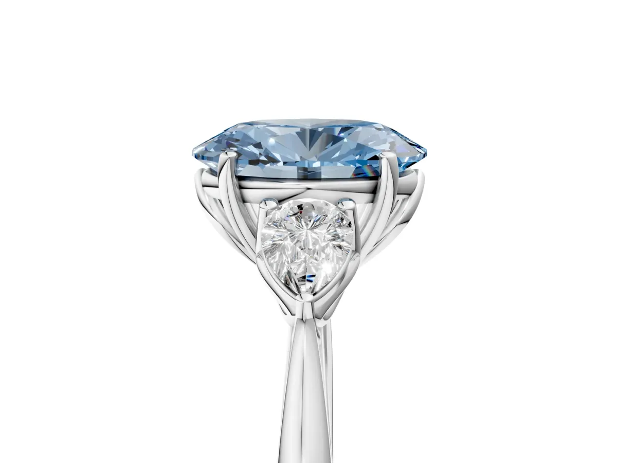 Fancy Blue Three-Stone Oval Cut Diamond Ring with Pear Side Stones in Four-Prong Setting White gold