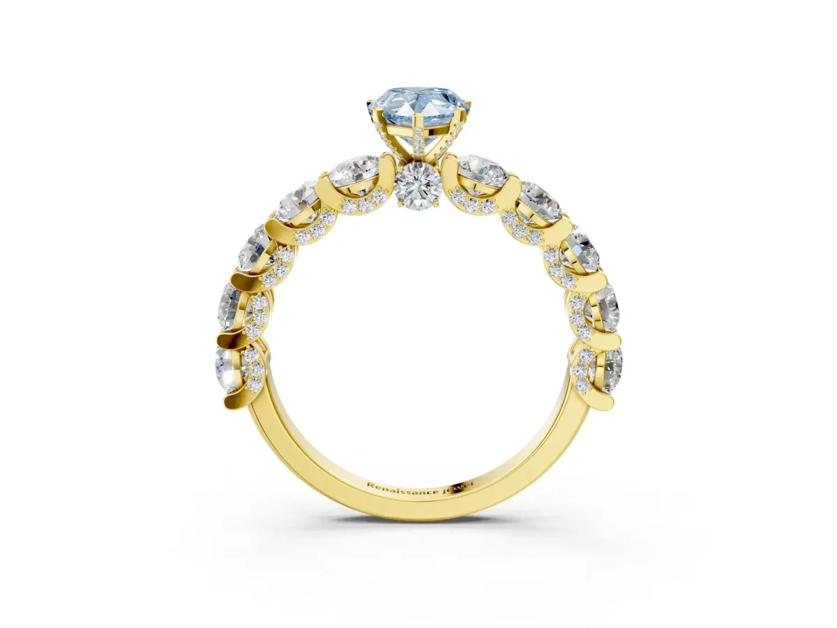 Fancy Blue Pear Cut Diamond Side Stone Engagement Ring with Four-Prong Setting Yellow gold