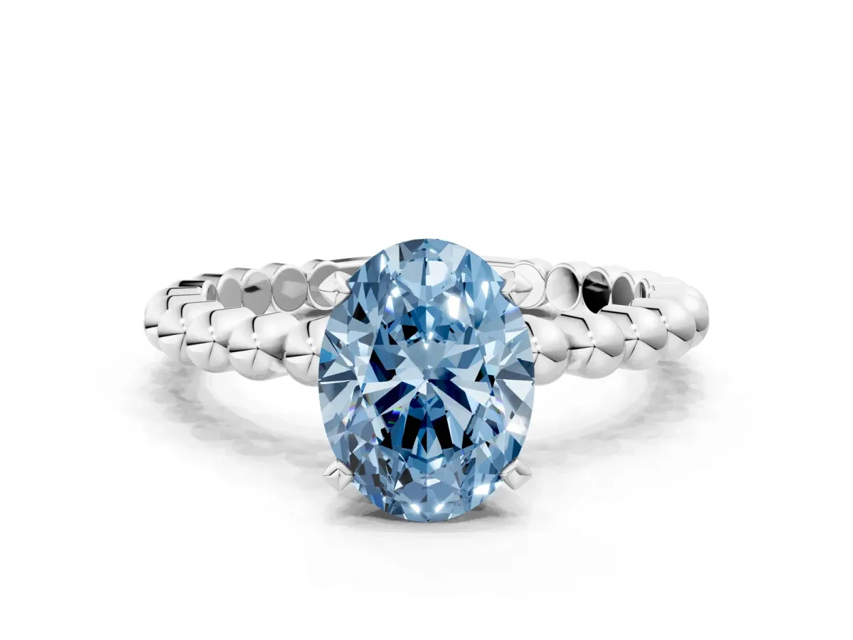 Fancy Blue Oval Cut Diamond Solitaire Ring with Beaded Band and Prong Setting Silver