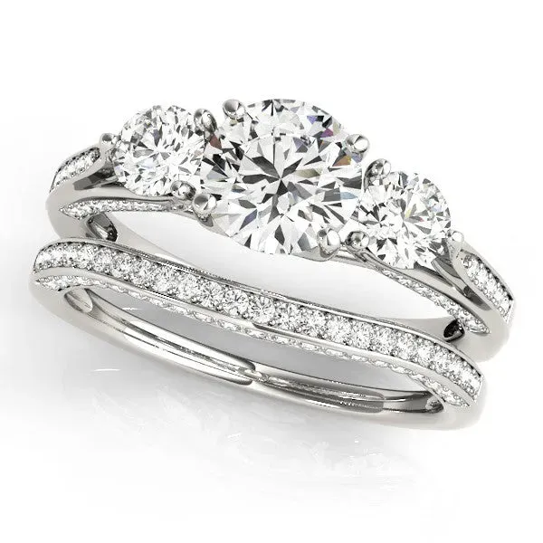 Round Cut Brilliant Three-Stone Engagement Ring with Split Shank and Prong Setting Platinum