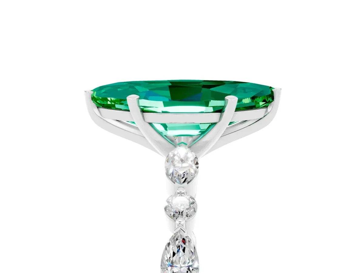 Marquise Cut Emerald Ring with Marquise and Round Side Stones and Four-Prong Setting Silver