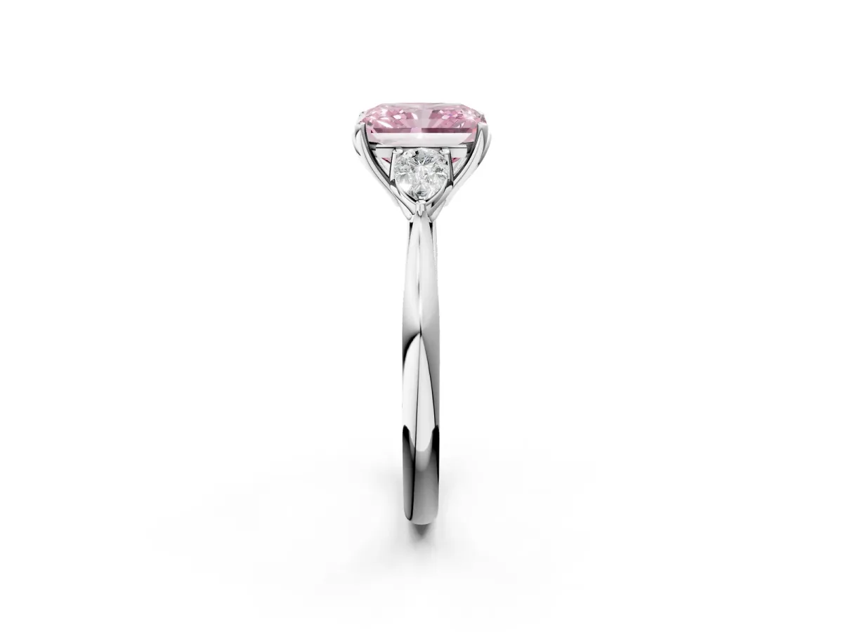 Fancy Pink Three-Stone Radiant Cut Diamond Ring with Pear Side Stones in Four-Prong Setting Platinum