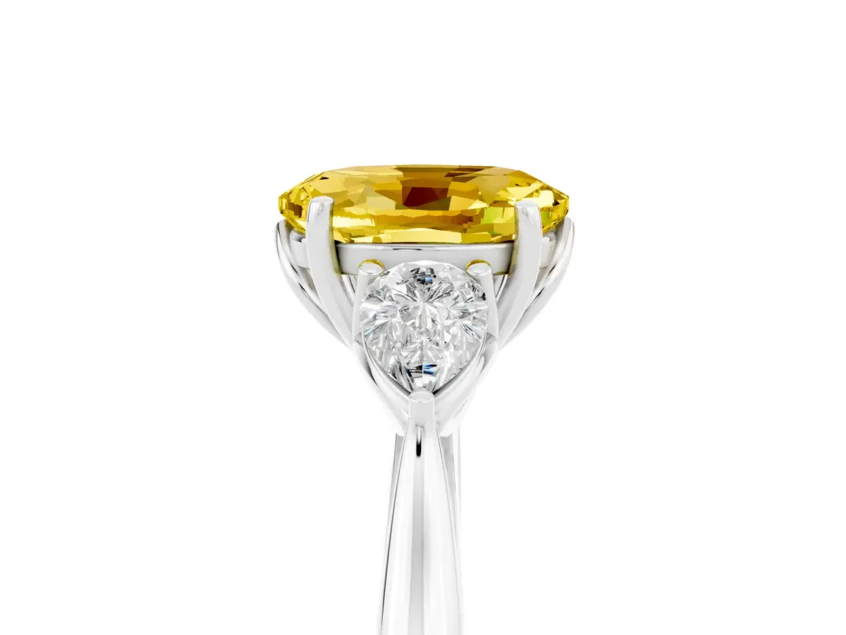 Three-Stone Oval Cut Yellow Sapphire Ring with Pear Side Stones in Four-Prong Setting White gold